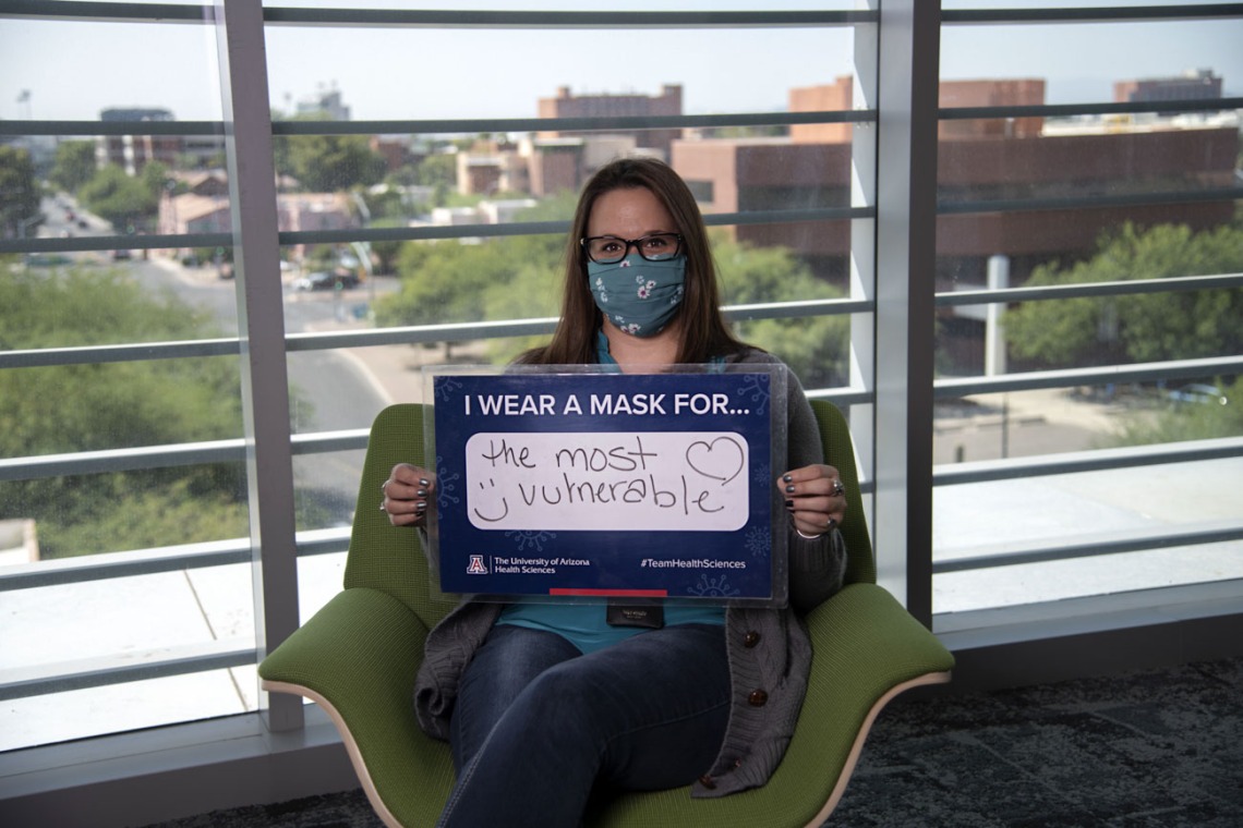Laura Desteiguer, administrator with the UArizona Center for Innovation in Brain Science wears a mask for the most vulnerable. 