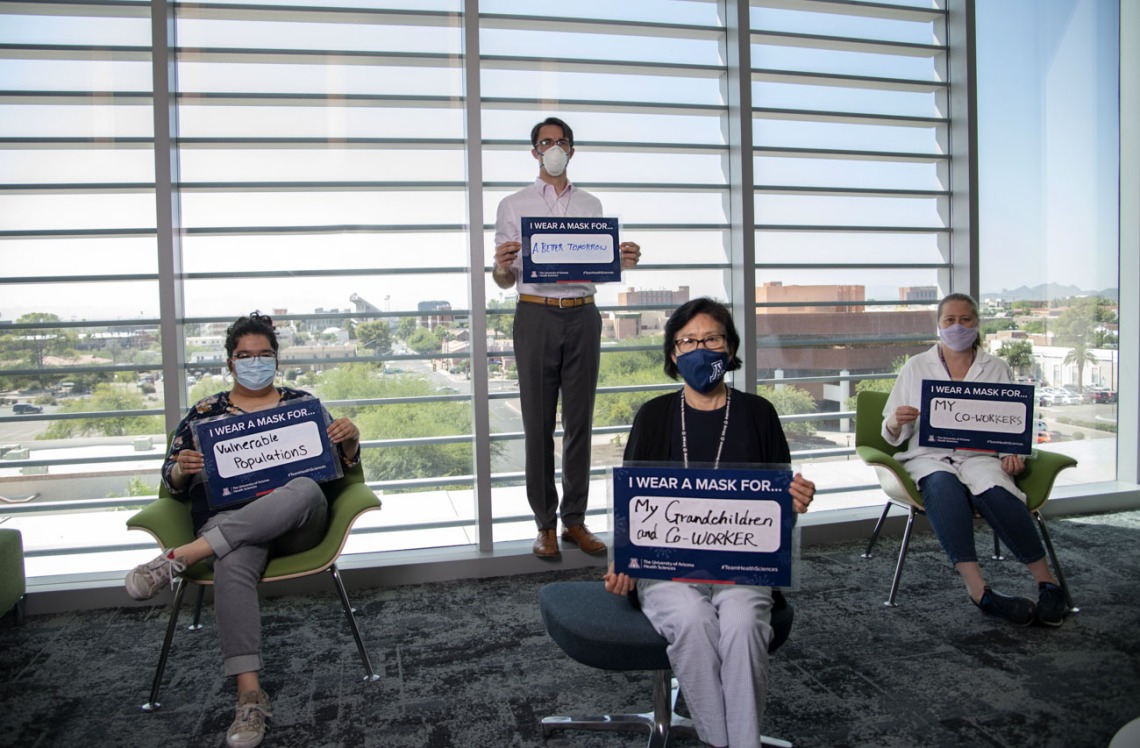 Nicole Delatorre, Alex Thome, PhD, Shuhua Chen and Lucia Whitman, PhD, from the Center for Innovation in Brain Science share their inspiration in the UArizona Health Sciences “I Wear a Mask” campaign.