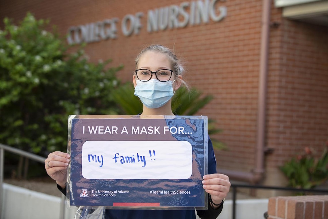 On the Tucson campus, College of Nursing student Tori Hyson wears a mask for her family. 