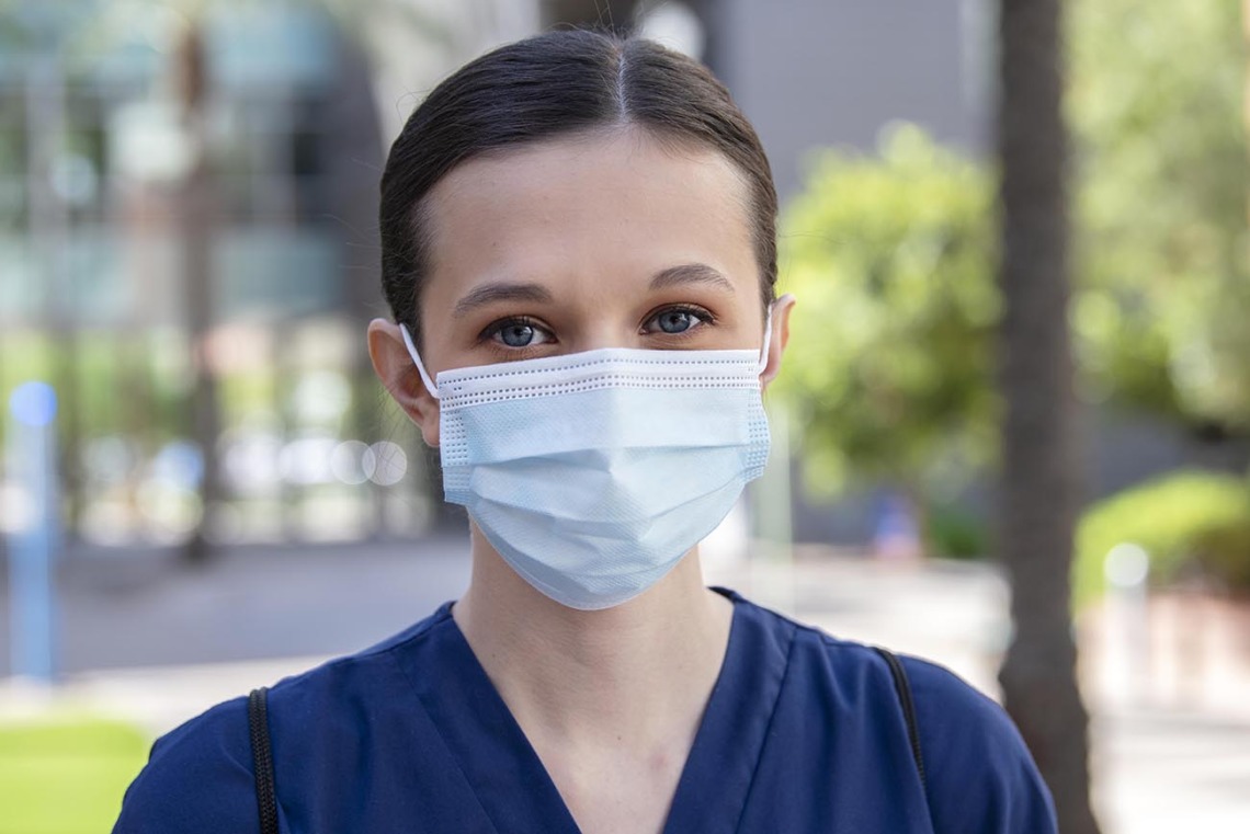 College of Nursing student BrookeLyn Black wears a mask for her patients in Tucson.