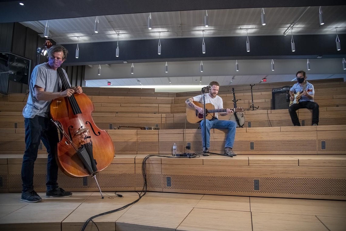 Tucson-area country and Americana artist Freddy Parish (center) performs in the University of Arizona Health Sciences Innovation Building for The Tucson Studio, a new program of UA Presents. Joining with Parish is bassist Thøger Tetens Lund and guitarist Nathan Fenoflio.