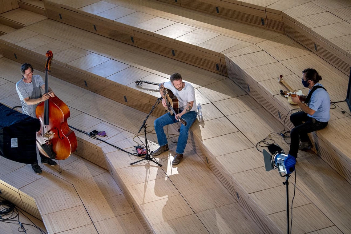 Freddy Parish performs in the Forum (center), with bassist Thøger Tetens Lund and guitarist Nathan Fenoflio. 