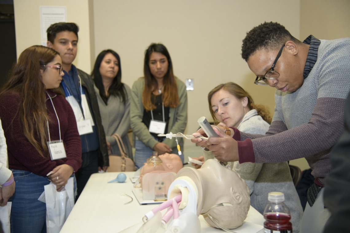 An anesthesiology specialist gives a demonstration on intubation.