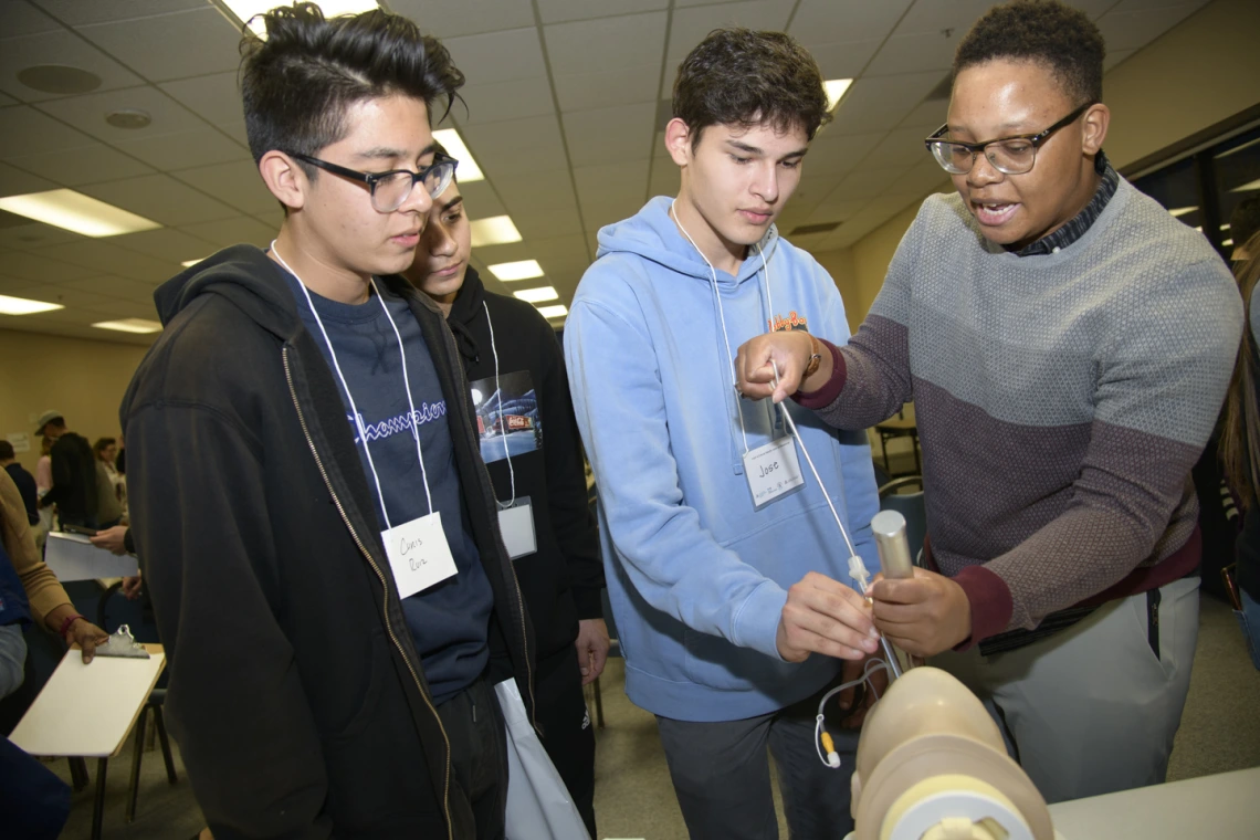 An anesthesiology specialist gives a demonstration on intubation.