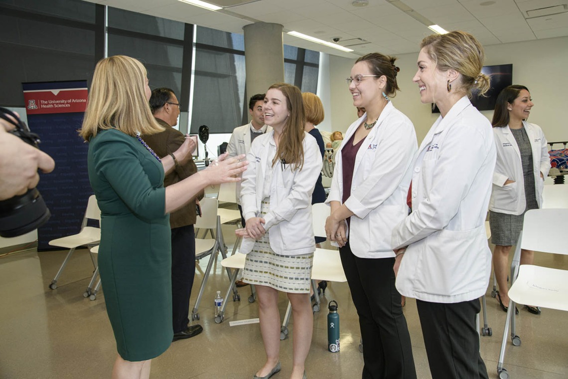 Phoenix Mayor Kate Gallego talks to Primary Care Physician scholarship recipients Merrion Dawson, Kathryn Blevins and Megan Kelly. 