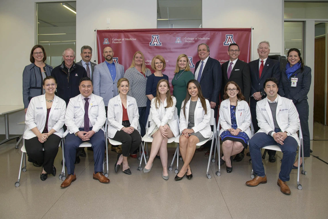 A group photo of Primary Care Physician scholarship recipients, University of Arizona staff and community members.