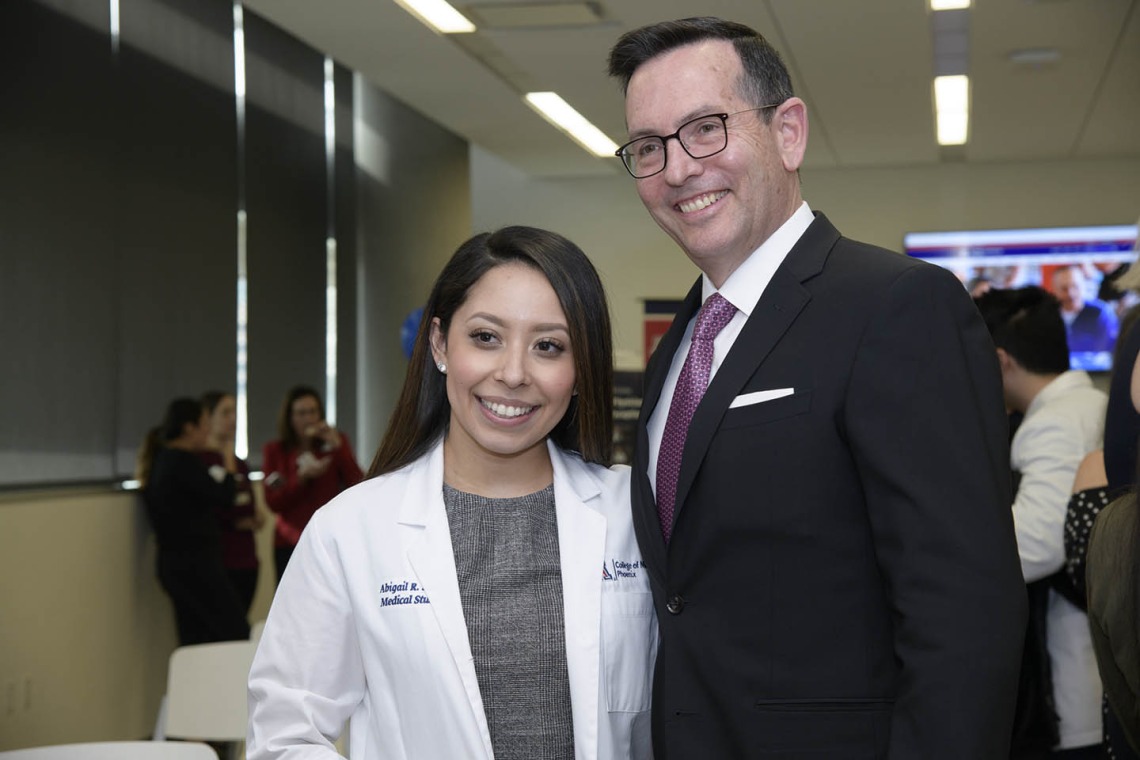 Primary Care Physician scholarship recipient Abigail Solorio poses for a photo with University of Arizona College of Medicine - Phoenix Associate Dean of Admissions and Recruitment Glen Fogerty, PhD, MBA.