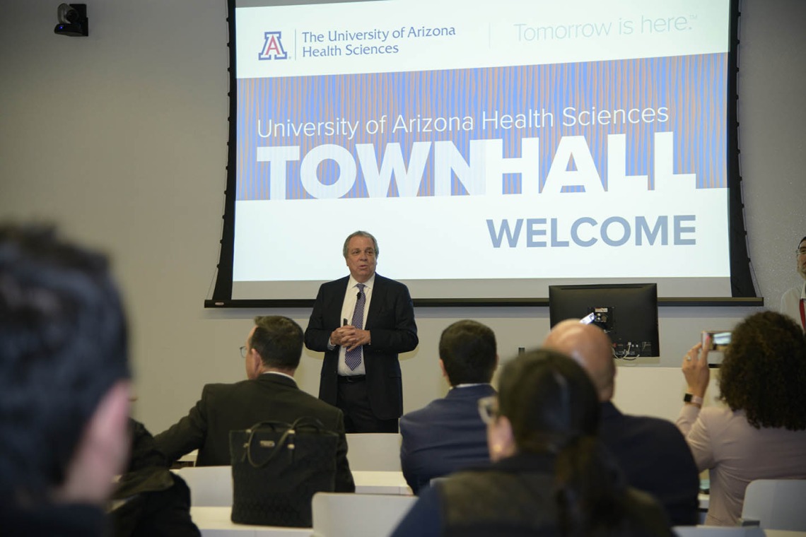 Senior Vice President for Health Sciences Michael D. Dake, MD, welcomes the audience to a town hall event in Phoenix.