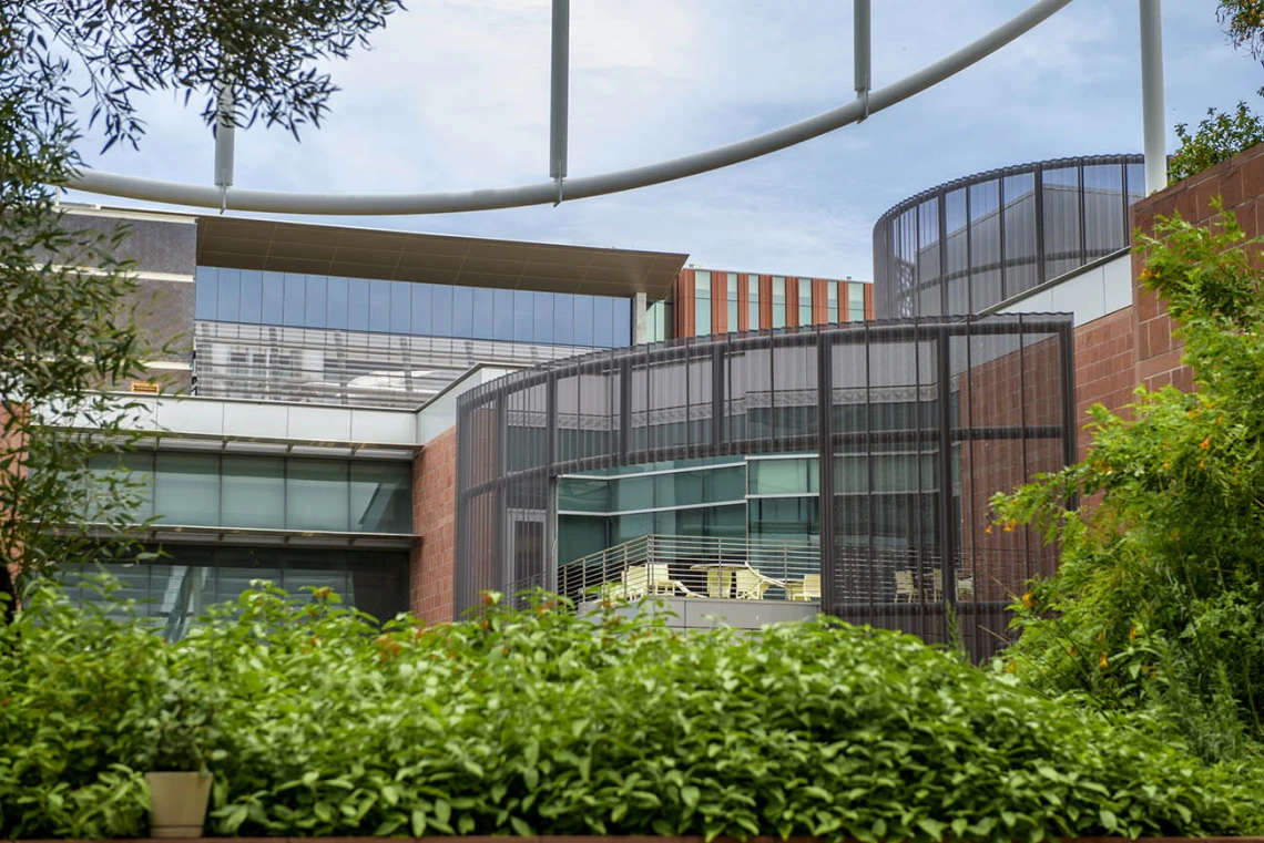 If right angles aren’t your thing, you may find the sweeping curves of the Medical Research Building’s balcony on the Tucson campus to your liking. You’ll be able to watch the clouds drift by through the white metal and shade-sail structure over the courtyard. 