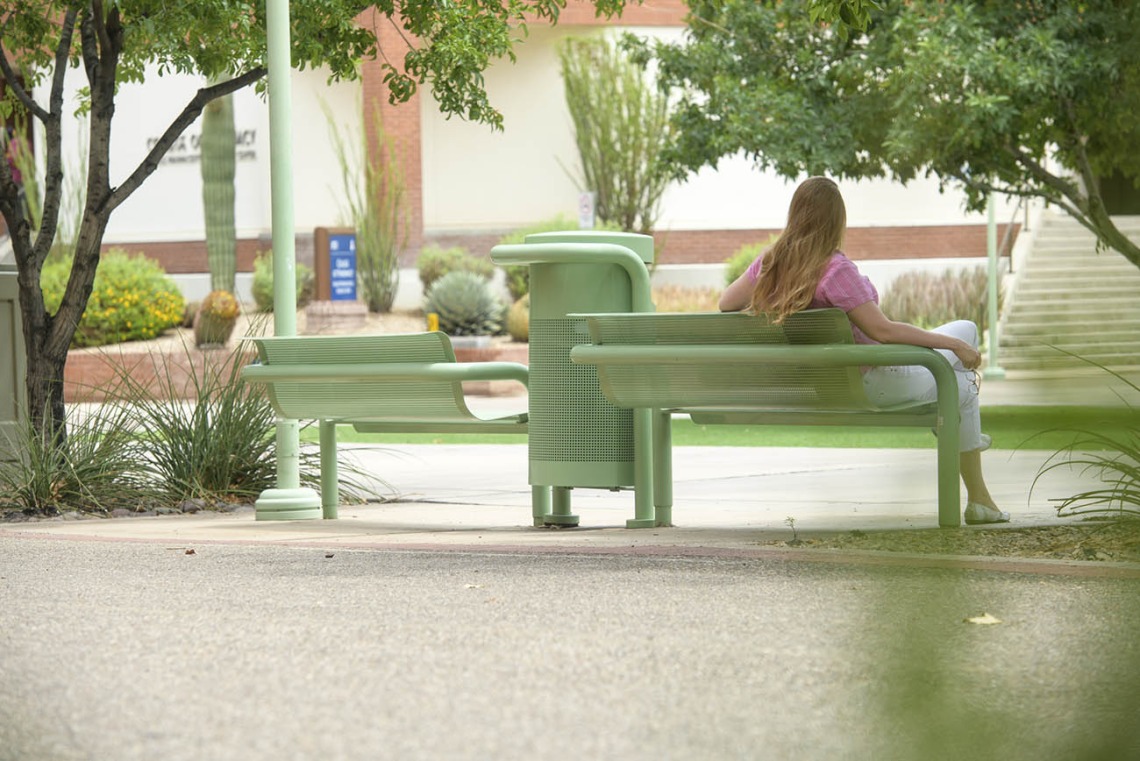 Sometimes a favorite place can be right in the middle of the action, like these shaded benches on the Tucson campus, flanked by a walking path on one side and a bike path on the other between Drachman Hall and the Medical Research Building. 