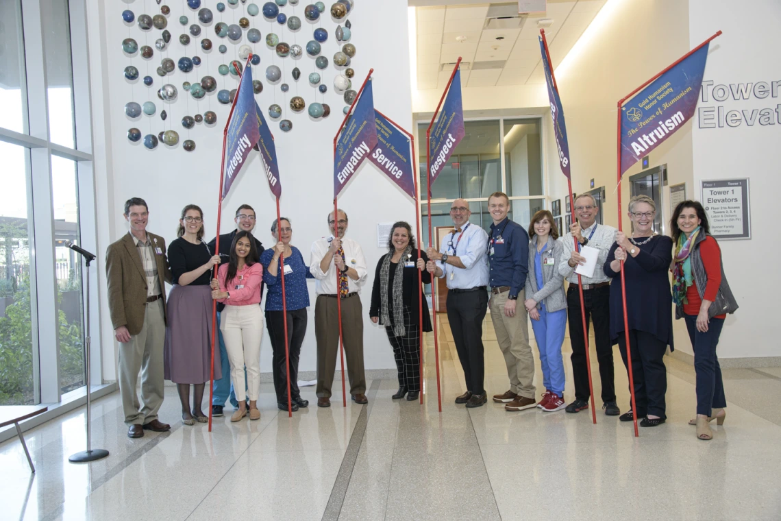 From left: Kevin Moynahan, MD, Dilara Onur (third-year medical student and Gold Humanism Honor Society inductee), Tyler Kennedy (fourth-year medical student), Natalie deQuillfeldt (third-year medical student and winner of poetry slam), Rachel Cramton, MD, Andreas Theodorou, MD, Noshene Ranjbar, MD, Josh Lee, MD, Joshua Gormley (third-year medical student), Darien Allen (fourth-year medical student and Gold Humanism Honor Society member), Richard Wahl, MD, Nancy Koff, PhD, and Violet Perez Siwik, MD.