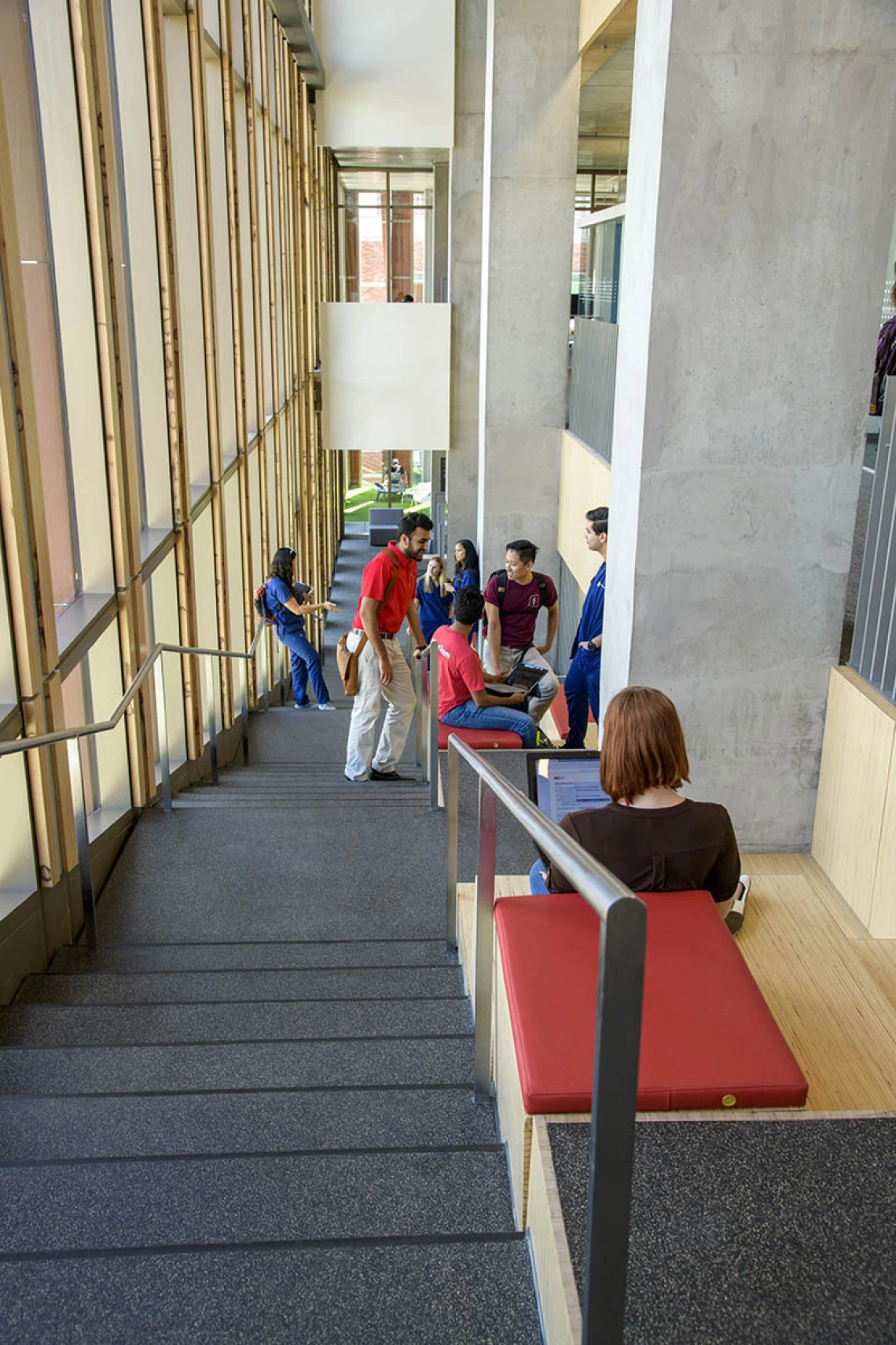 The eastern stairway between the fourth and sixth floors in the Health Sciences Innovation Building has a built-in seating areas with a view. Each padded seating area is also equipped with electrical outlets. 