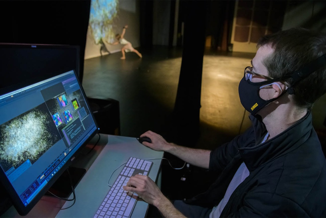 To produce StellarScape, data is collected from the sensors and processed in near real-time by a computer, providing the audience with the allusion that the dancer is creating the movements of particles on the video screen in the background.