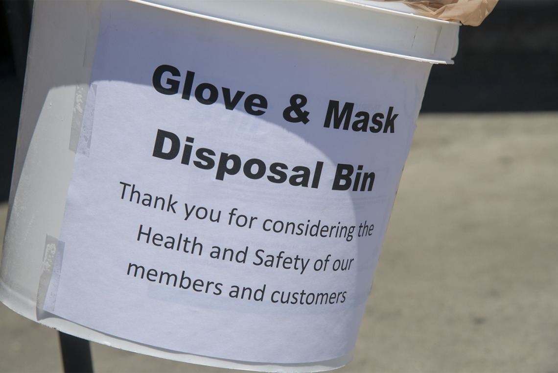 A glove and mask disposal bin in a Food City grocery store in Tucson, one of many changes grocery stores have implemented to help protect public safety in the pandemic. The store is also hanging posters designed by College of Medicine – Tucson students to help encourage masking, social distancing and hand washing.