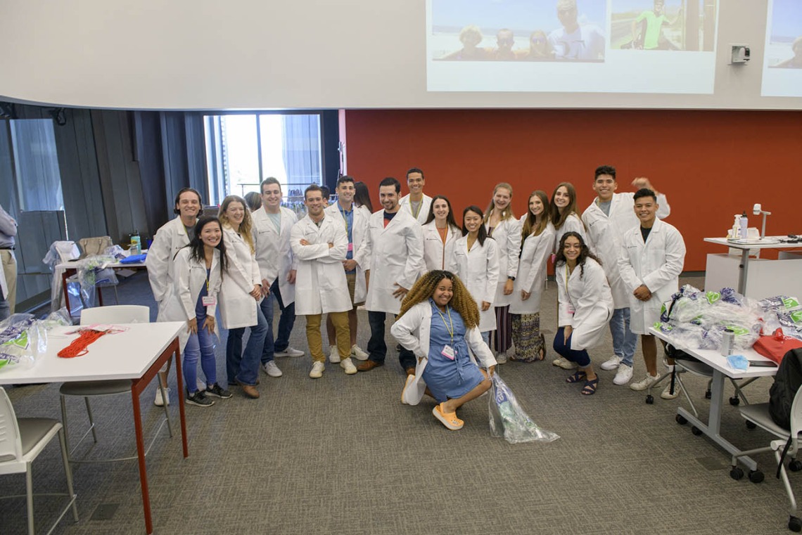 UArizona College of Medicine – Tucson first-year medical students pose for a group photo after being fitted for their white coats inside the Health Sciences Innovation Building prior to the white coat ceremony.