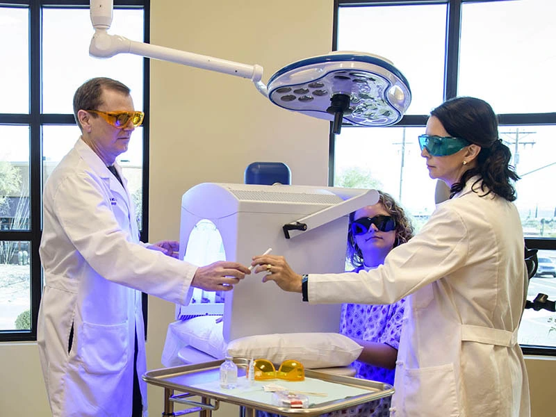 two health professionals handing off specimen