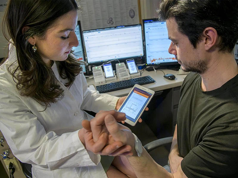 provider shows patient results on small tablet