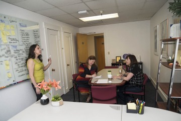 Elise Lopez, DrPH, MPH, (left), director of the UArizona Consortium on Gender-Based Violence, at a team meeting with community outreach specialist Cynthia Chapman (center), and Allison Latham-Jones, sexual violence prevention specialist.