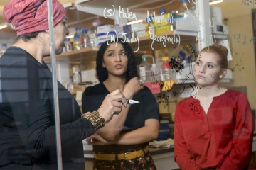 From left: Dr. May Khanna, Jaesa Strong and Christina Moehring perform proof-of-concept experiments in the Khanna Lab in the Center for Innovation in Brain Science.