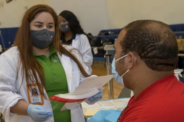 Sammy Zimmerman, a PharmD student on the Phoenix campus, came to Tucson for the opportunity to give flu shots to UArizona students.