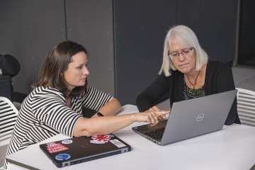 Kristen Pogreba-Brown, PhD, MPH, and Melanie Bell, PhD, MS, a professor of epidemiology and biostatistics in the Mel and Enid Zuckerman College of Public Health, examine data from the AZ CoVHORT study to identify COVID-19 trends and effects.