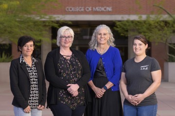 (From left) Gondy Leroy, PhD, Jennifer Andrews, PhD, Sydney Rice, MD, and Maureen Kelly-Galindo, MS, RN, of the College of Medicine – Tucson’s Division of Genetics and Developmental Pediatrics, are working together to more quickly diagnose autism based on language used in clinician notes on patient evaluations.