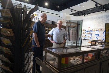 (From left) Eric Reiman, MD, a professor of psychiatry at UArizona, executive director of the Banner Alzheimer's Institute, and CEO of Banner Research, and UArizona R. Ken Coit College of Pharmacy Dean Rick G. Schnellmann, PhD, view the Coit Museum of Pharmacy & Health Sciences exhibits.