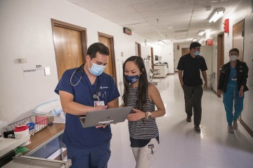 Diaz discusses a case with Lily Nguyen, RN, a second-year medical student who served as the clinic’s lead coordinator during the fall semester. Nguyen says the Shubitz Family Clinic provided practical experience that could one day help her open her own practice.