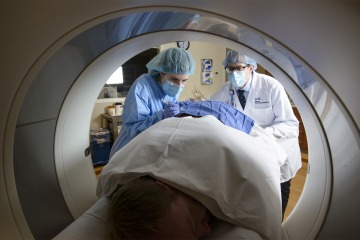 A patient undergoes a CT scan, a way to capture images of a person's organs or skeletal system.
