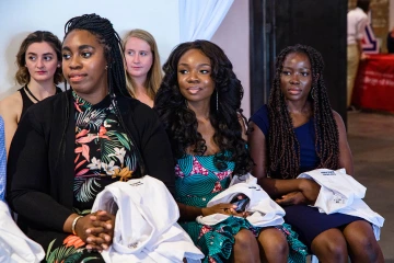 Chikodi Ohaya (center), a first-year student at the College of Medicine – Phoenix, at the Class of 2025 White Coat Ceremony in July 2021. Ohaya is a member of the college’s chapter of the Student National Medical Association, which comprises medical students of color, and White Coats for Black Lives.