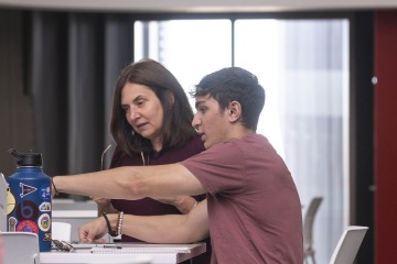 Bridget Murphy works with a student in her classroom.