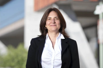 Bridget Murphy poses for a picture outside the Health Sciences Innovation Building.