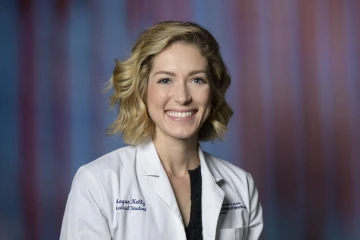 Dr. Megan Kelly wearing a College of Medicine – Phoenix white coat