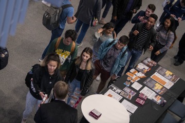 University of Arizona Health Sciences students at an opioid overdose prevention training stand in line to receive naloxone kits