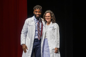 (From left) Atehkeng (Ateh) Zinkeng, PSM, of Cameroon, is pursuing his passion for medicine and research in the MD-PhD program in the College of Medicine – Tucson. On the right is his mentor Audrey Baker, MD, associate professor of otolaryngology in the College of Medicine – Tucson. 
