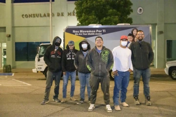 From left: Oscar Moreno, Mara Rodriguez, Jairo Lopez, Ruben Sosa, Nestor Quiñonez and Jesús Pérez, farm workers from the Agua Prieta, Mexico, area, gather before sunrise at the Consulate General of Mexico in Douglas for a COVID-19 vaccine clinic.