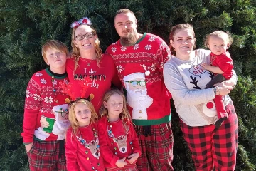 Family in front of tree