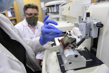 As part of the research process, a Procyon encapsulation device is sectioned into thin slices that will be analyzed under a microscope.   