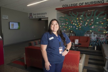 Clarissa Padilla stands in the UArizona College of Nursing Gilbert lobby.