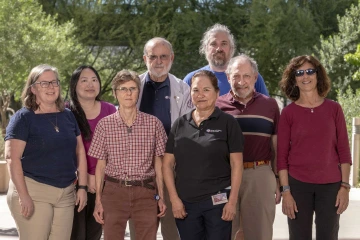 Team members of the Valley Fever Center for Excellence at the University of Arizona College of Medicine – Tucson pose for a portrait outside.