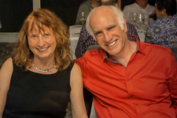 Richard D. Lane and Karen Weihs, sitting next to each other and smiling.