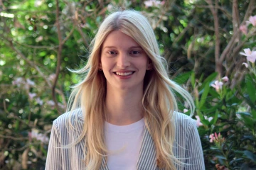Portrait of a young woman in an outdoor setting