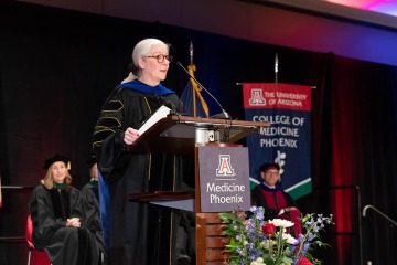 Mary O'Reilly, PhD, vice president of bioscience research programs at the Flinn Foundation, addresses the students and their guests during the 2022 College of Medicine – Phoenix commencement.