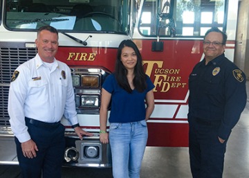 Doctoral student Alesia Jung with Deputy Chief Darin Wallentine (left) and Capt. John Gulotta (right) from the Tucson Fire Department.