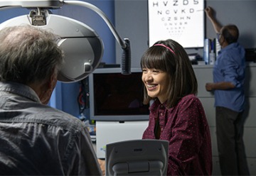 Anna Figueroa conducts a visual acuity test on a study patient.