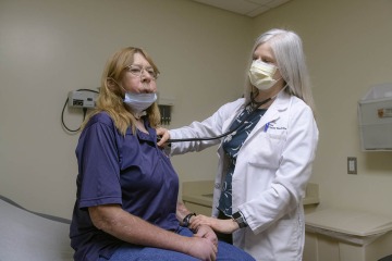 Julie E. Bauman, MD (right), opened a clinical trial to test a new combination of monoclonal antibody drugs designed to help HPV-negative head and neck cancer patients like Barbara Ann Jones (left).
