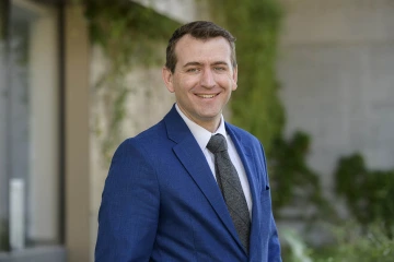 Man in business suit smiling 