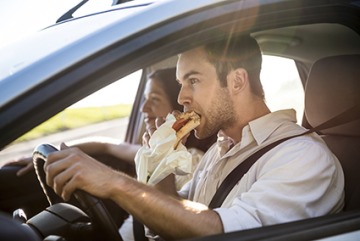 Man eating while driving