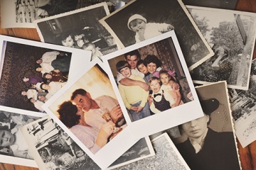 Pile of family photographs on a table