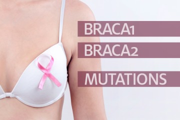Midsection Of Woman With Pink Breast Cancer Awareness Ribbon On Her Bra 